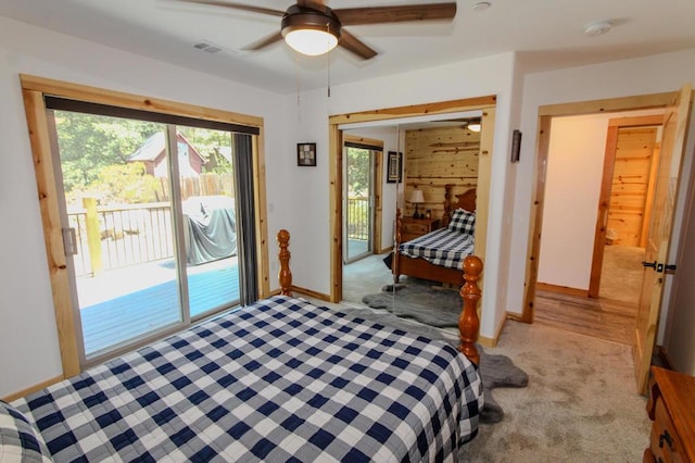 carpeted bedroom featuring ceiling fan and access to exterior