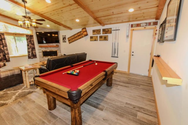 recreation room featuring wood ceiling, a large fireplace, ceiling fan, and hardwood / wood-style floors