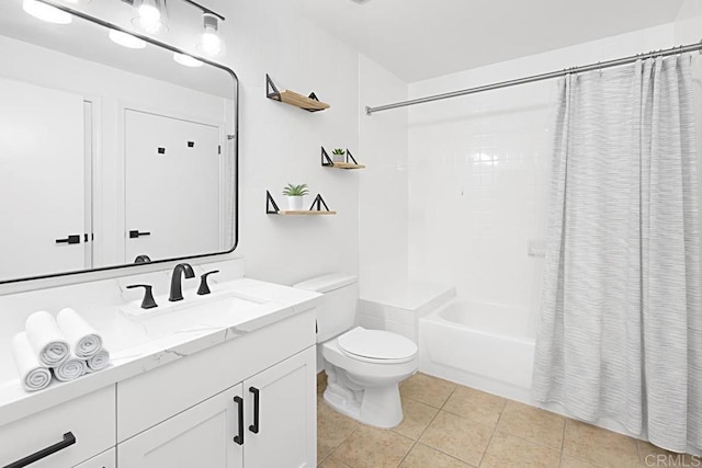 bathroom featuring tile patterned flooring, shower / tub combo with curtain, vanity, and toilet