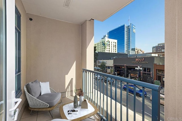 balcony featuring a view of city and visible vents