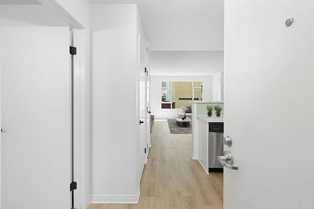 hallway featuring light wood-style flooring