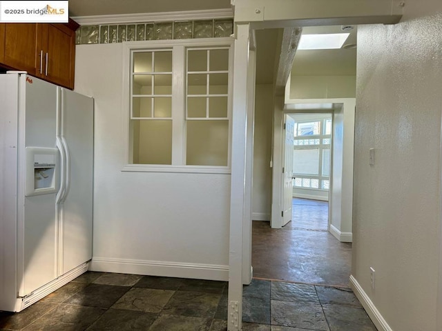 kitchen with white fridge with ice dispenser