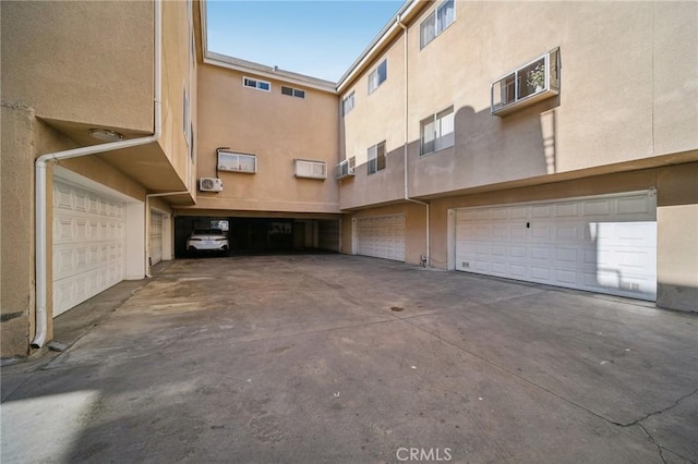 exterior space featuring a wall unit AC