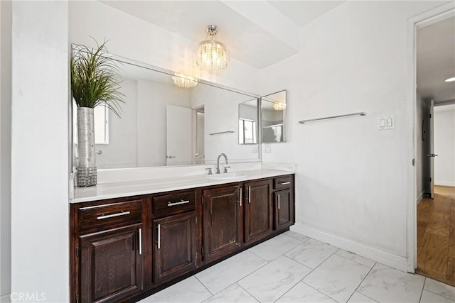 bathroom featuring vanity and an inviting chandelier