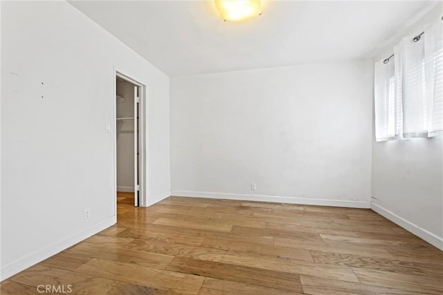 unfurnished room featuring light hardwood / wood-style floors