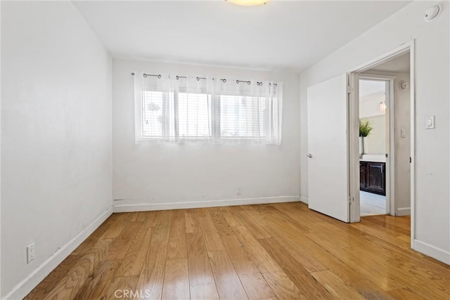 unfurnished room featuring light hardwood / wood-style flooring