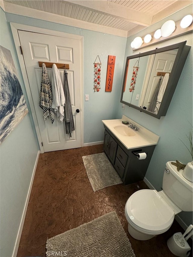 bathroom featuring vanity, beamed ceiling, wooden ceiling, and toilet