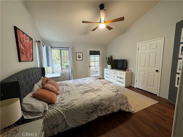 bedroom with dark wood-type flooring, vaulted ceiling, and ceiling fan