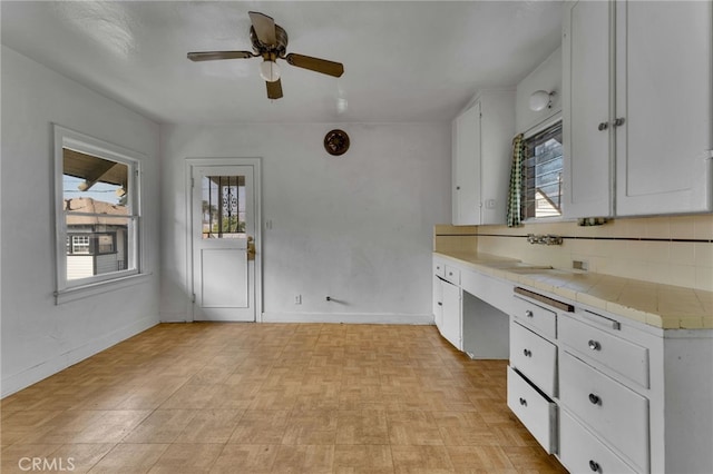 bathroom with backsplash and ceiling fan