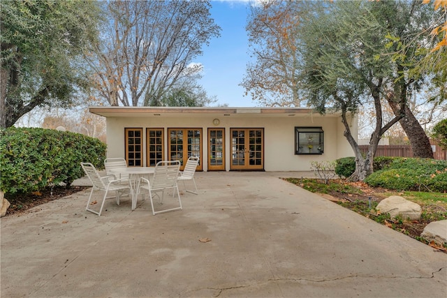 rear view of house featuring french doors and a patio