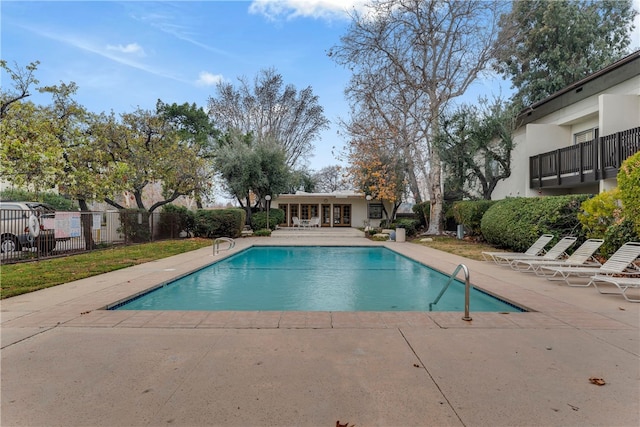 view of swimming pool featuring a patio area