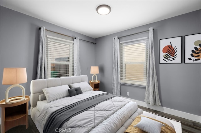 bedroom with wood-type flooring