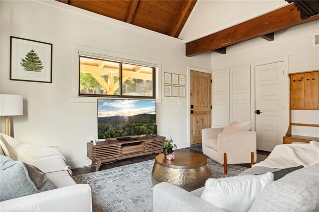 living room with hardwood / wood-style flooring, vaulted ceiling with beams, and wooden ceiling