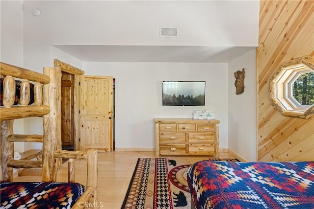 bedroom with light hardwood / wood-style floors