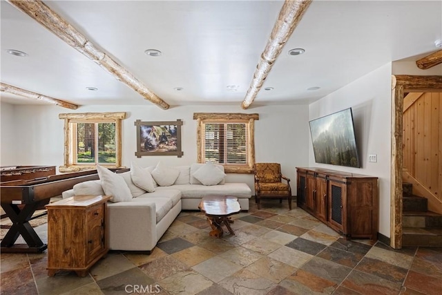 living room featuring beamed ceiling