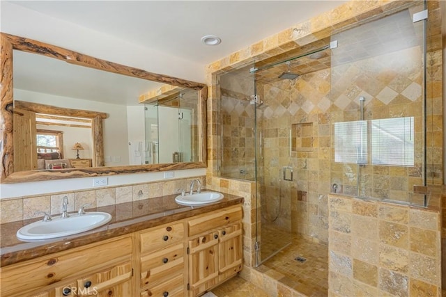 bathroom with vanity and an enclosed shower