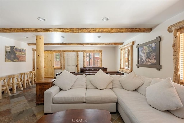 living room with beamed ceiling