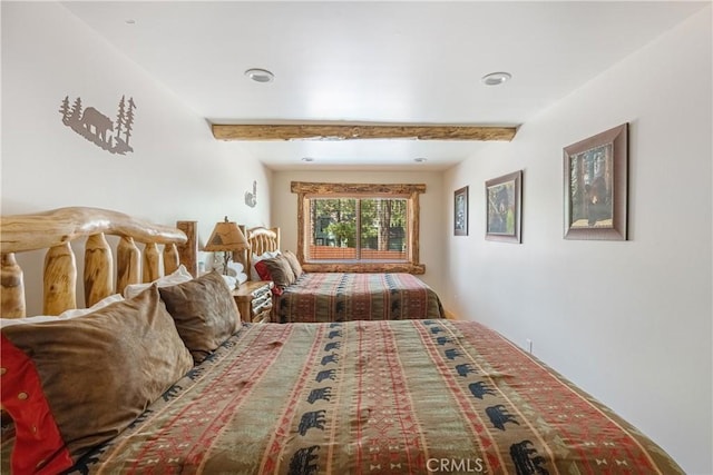 bedroom featuring beamed ceiling