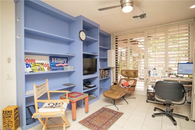 office with ceiling fan and light tile patterned flooring