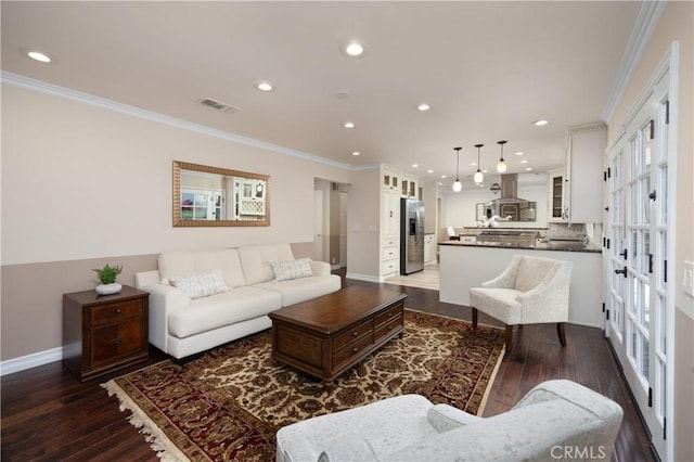 living room with crown molding and dark wood-type flooring