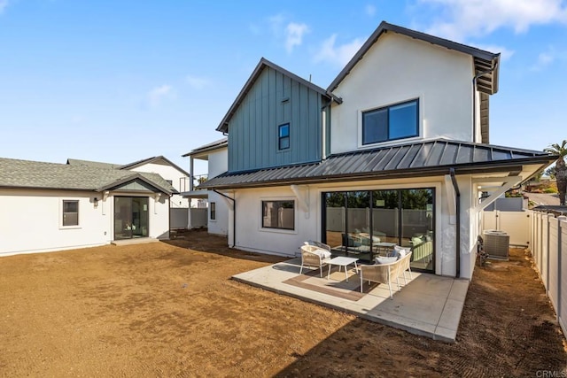 back of house featuring central AC and a patio area