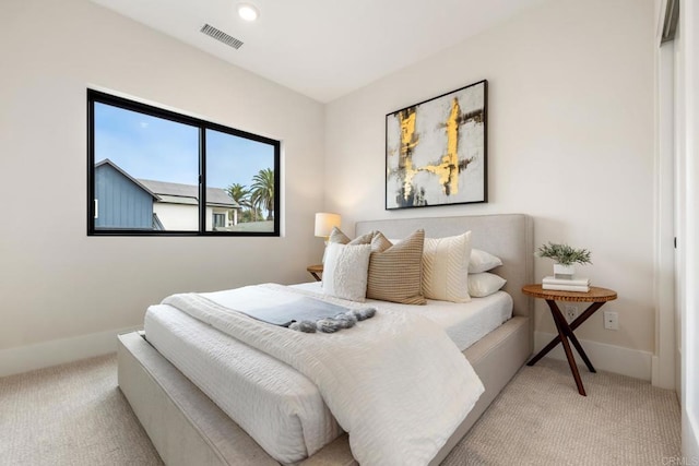 bedroom featuring light carpet