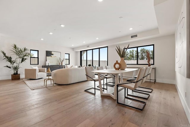 dining space featuring light wood-type flooring