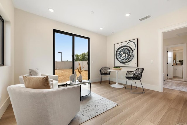 sitting room featuring light wood-type flooring