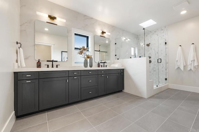 bathroom with walk in shower, tile patterned floors, vanity, and a skylight