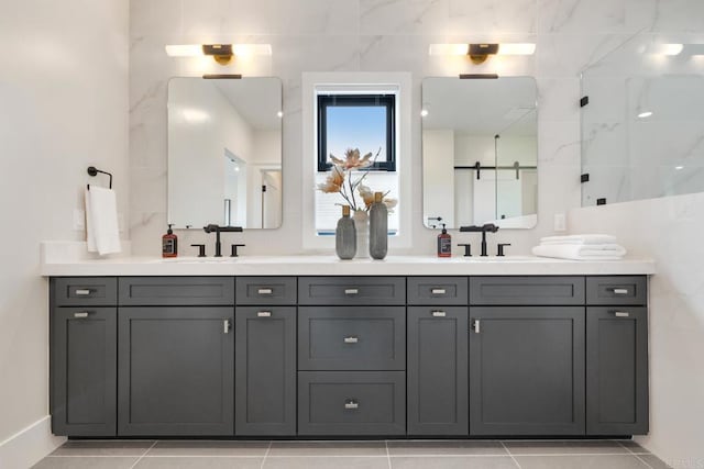 bathroom with walk in shower, tile patterned floors, and vanity