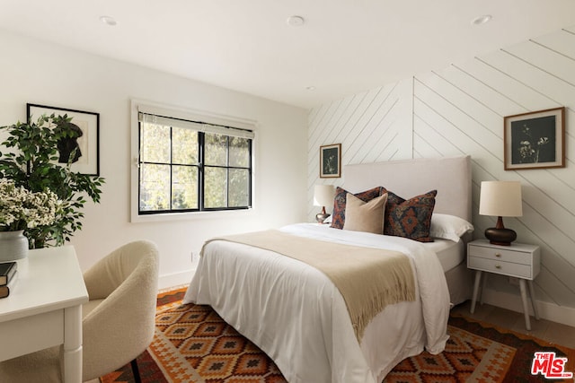 bedroom with wooden walls