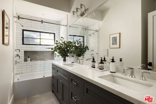 bathroom featuring vanity, tiled shower / bath combo, and tile patterned floors