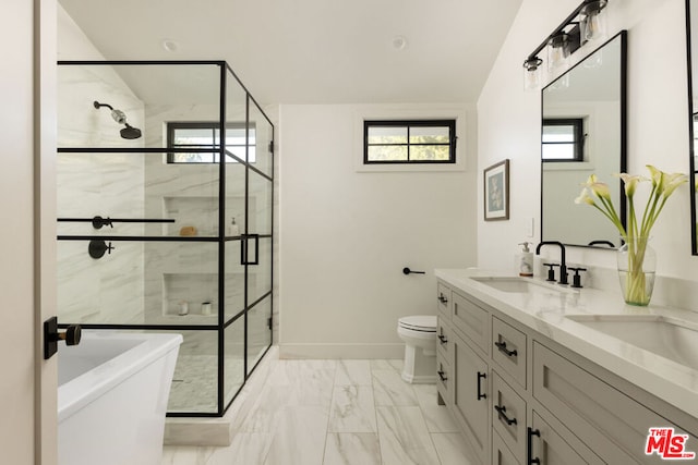 full bathroom with vanity, toilet, and separate shower and tub