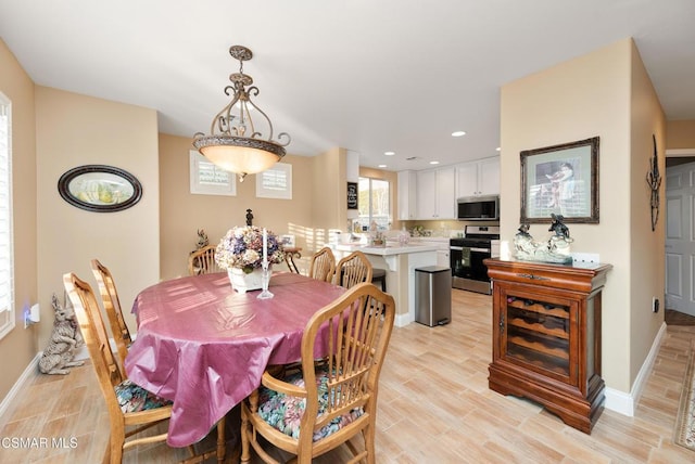 dining room featuring light hardwood / wood-style floors