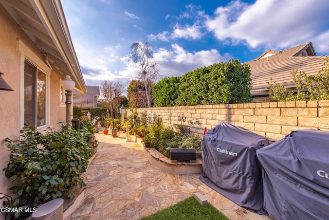 view of patio featuring a grill