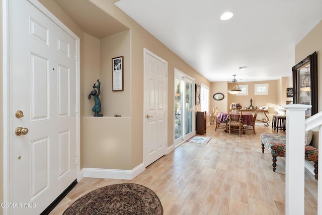 foyer with light hardwood / wood-style floors