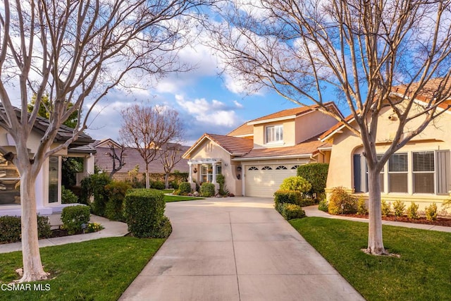 view of front of property featuring a garage and a front lawn