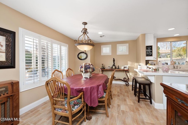 dining area with light hardwood / wood-style flooring