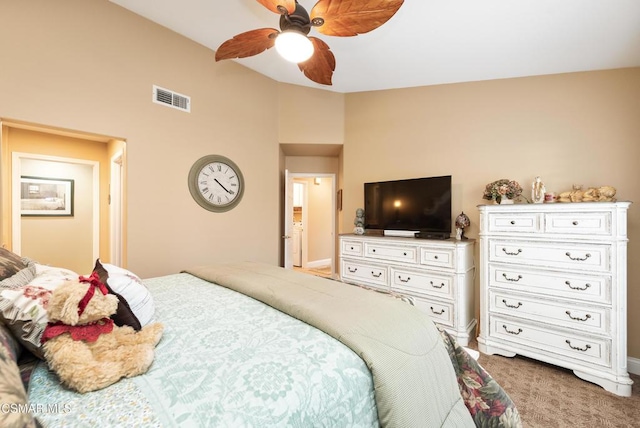 bedroom featuring vaulted ceiling, ceiling fan, and carpet floors