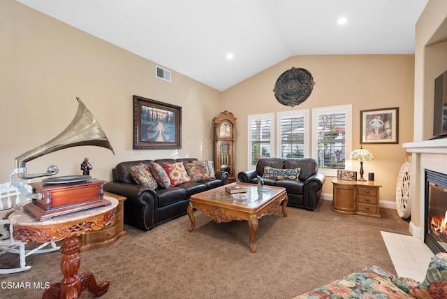 living room with a fireplace, vaulted ceiling, and light carpet