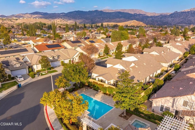 birds eye view of property with a mountain view