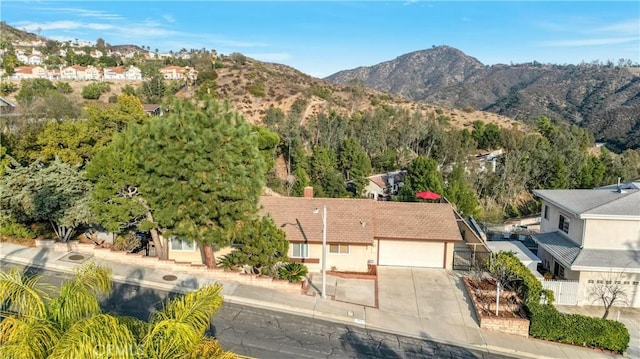 birds eye view of property featuring a mountain view