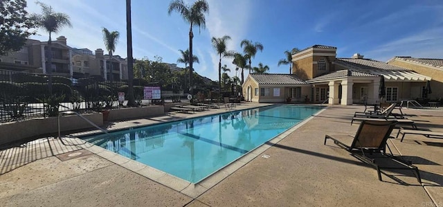 view of swimming pool featuring a patio area