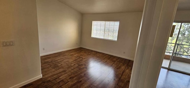 spare room featuring dark hardwood / wood-style floors