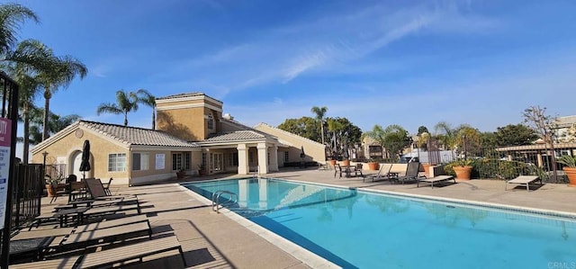 view of swimming pool with a patio area