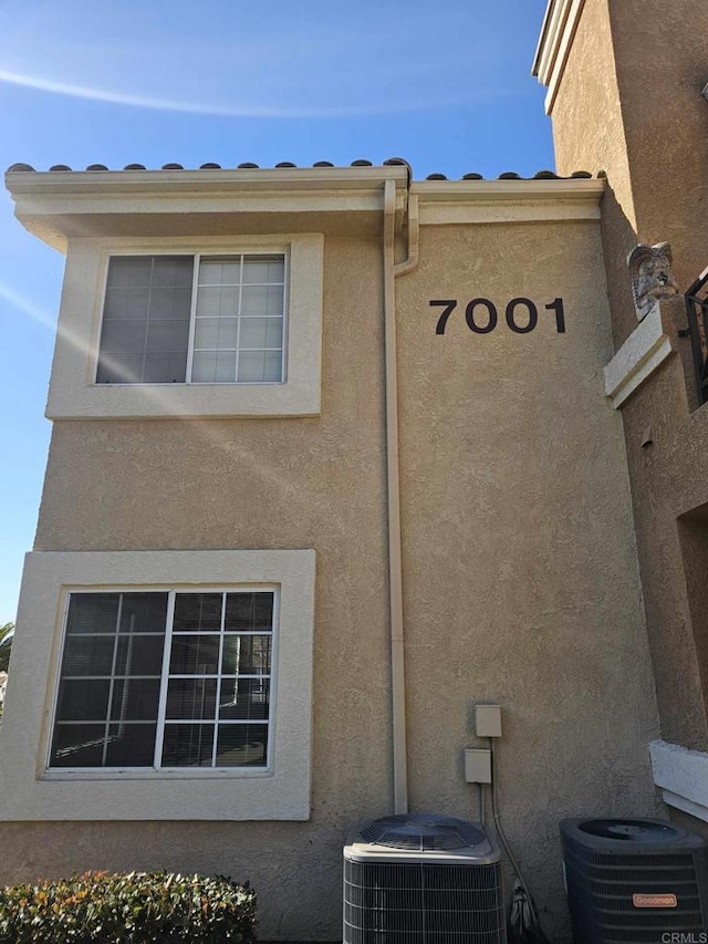 view of property exterior with central air condition unit