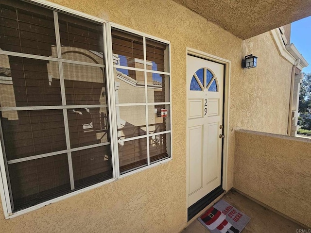 entrance to property featuring a balcony