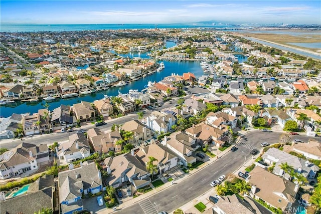 aerial view with a residential view and a water view