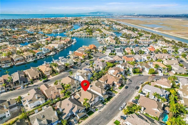 aerial view with a water view and a residential view