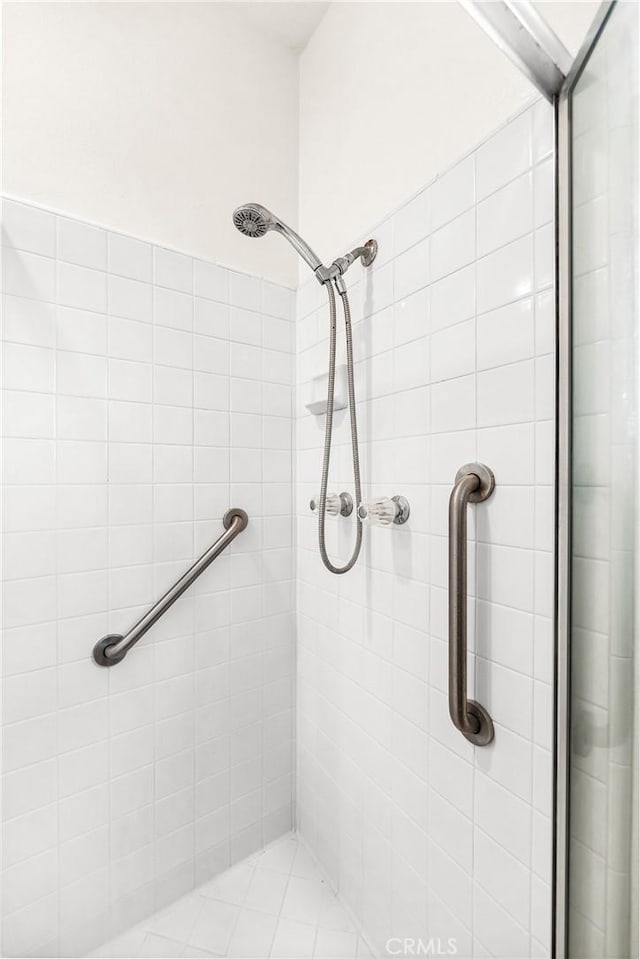 full bathroom with tiled shower